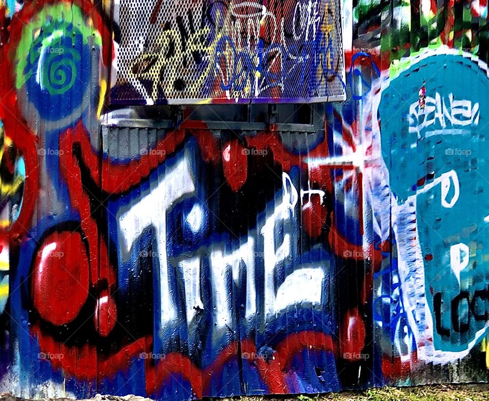 Bold graffiti art depicting the word time 