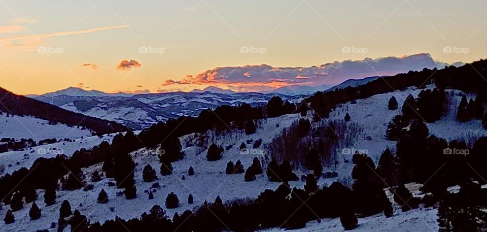 Sunset within the snowy peaks