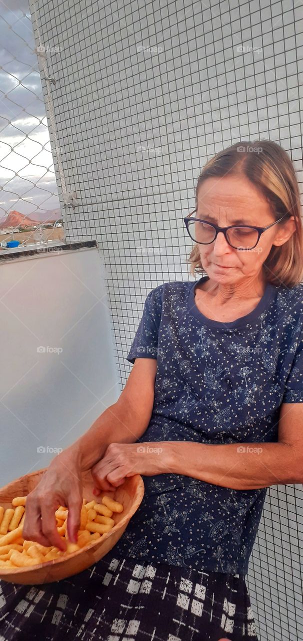aunt eating snacks on the porch