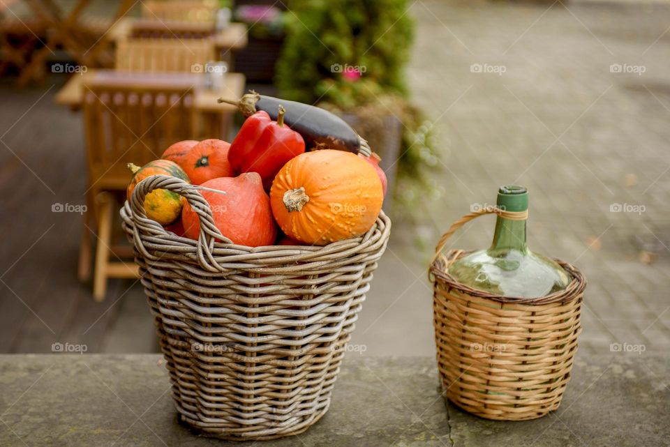 Decoration for Halloween.  Basket with pumpkin and vegetables