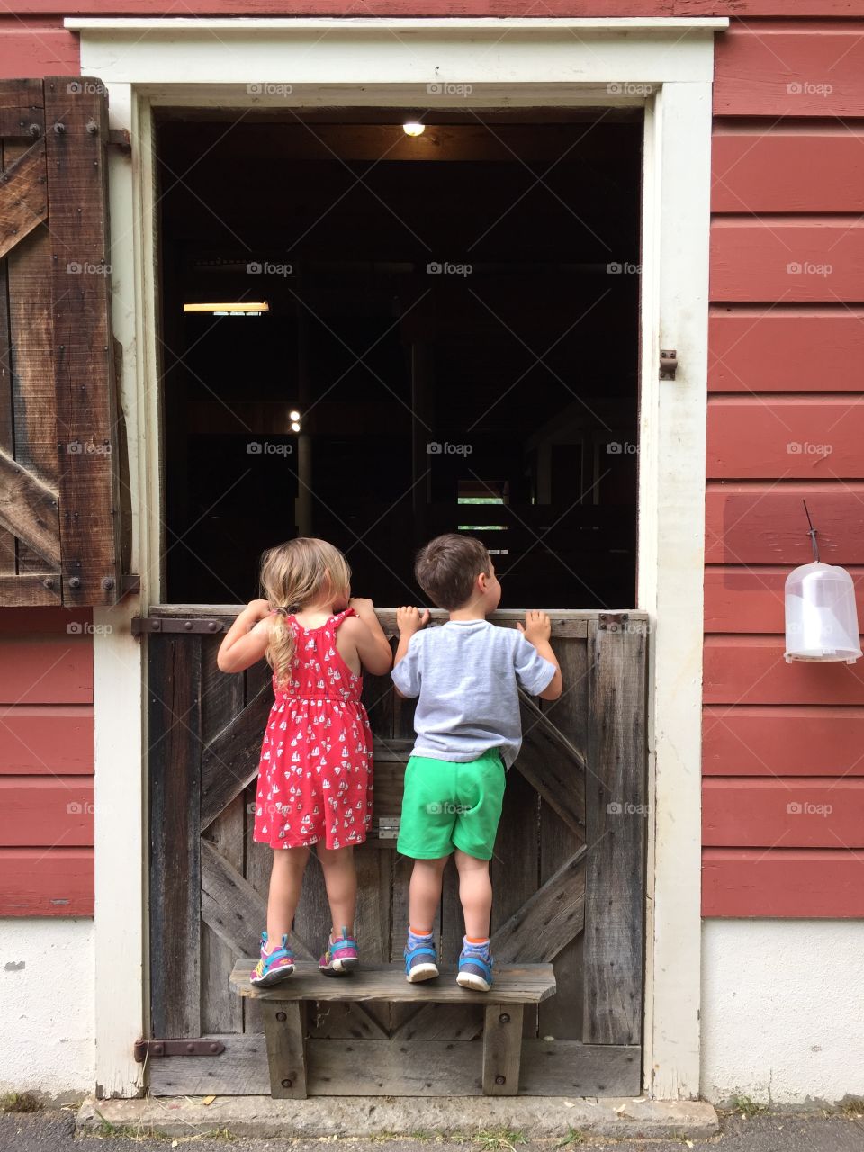 Kids Peeking into a Barn