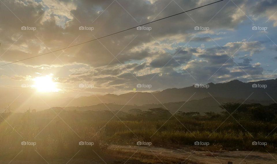 beautiful sunrise on the plain, you can see the mountains and the flash of sunlight on the mountains