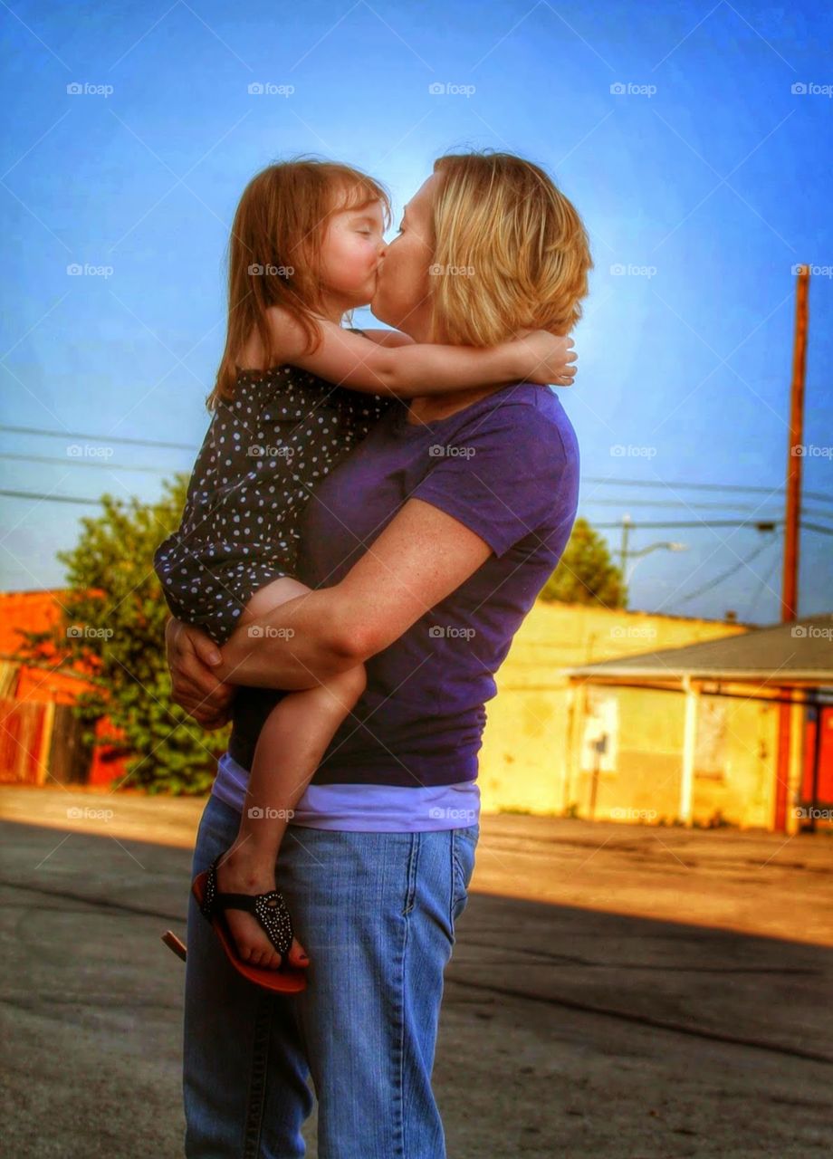 Loving hug. Mother daughter time caught on camera 