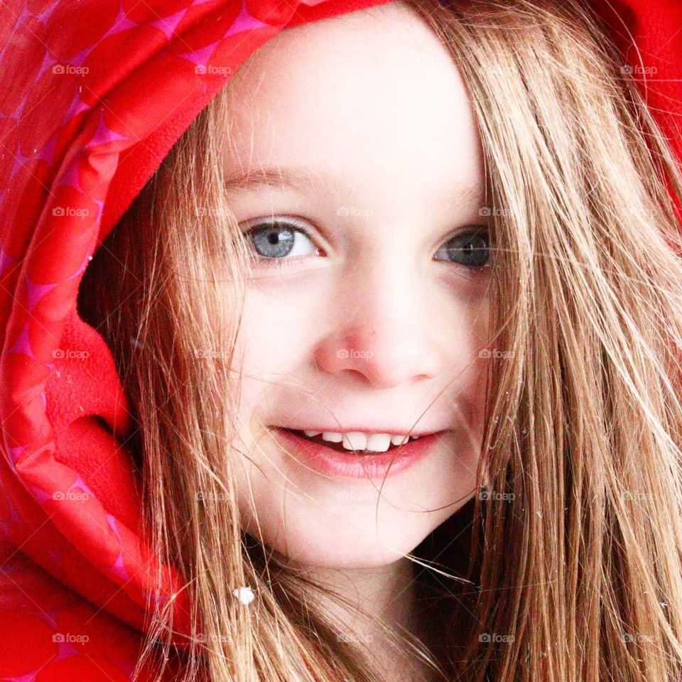 blue eyes with red coat on in winter