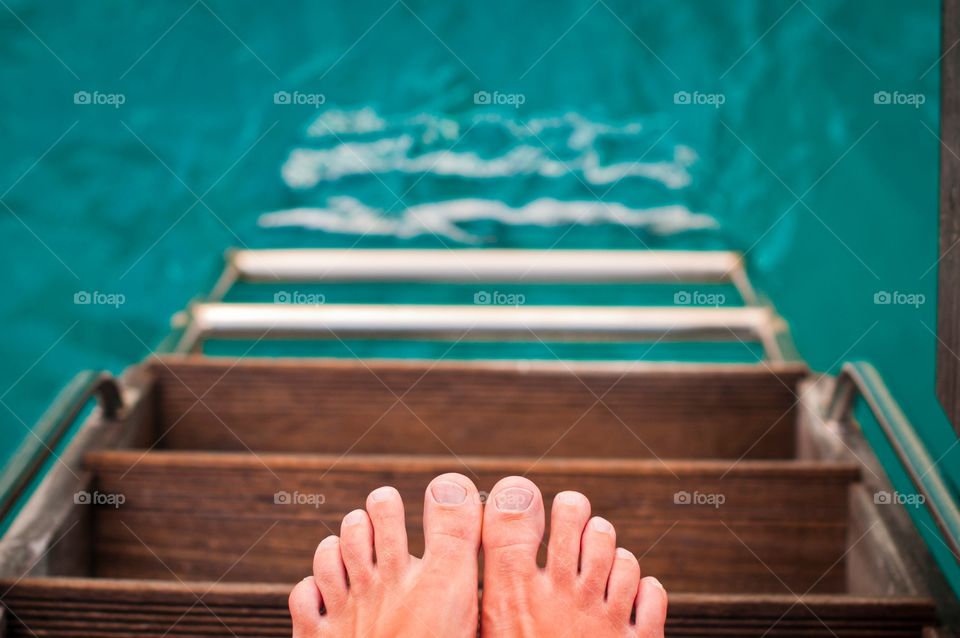 Toes on the steps to ocean in Bora Bora