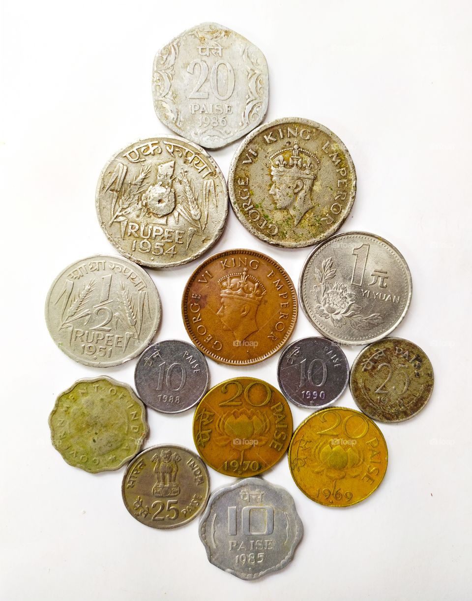 Colourful Antique Coin Collection. Started coin collection as just timepass now having large collection of rare coins. All coins can't be captured in single photo. So these are some coins containing Old British-India coin, one Chinese coin(Yen), etc.