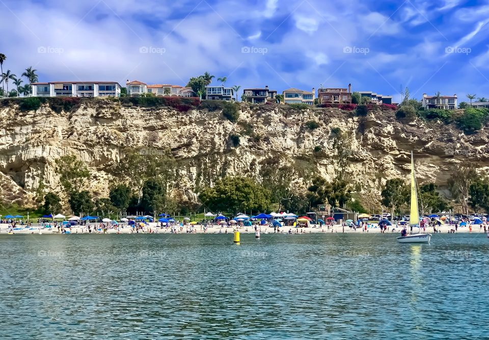 Foap Mission Landscape Beauty! Beach With Colorful Beach Umbrellas And Sail Boat At the Base Of Sand Cliffs Along The Southern California Coastline!