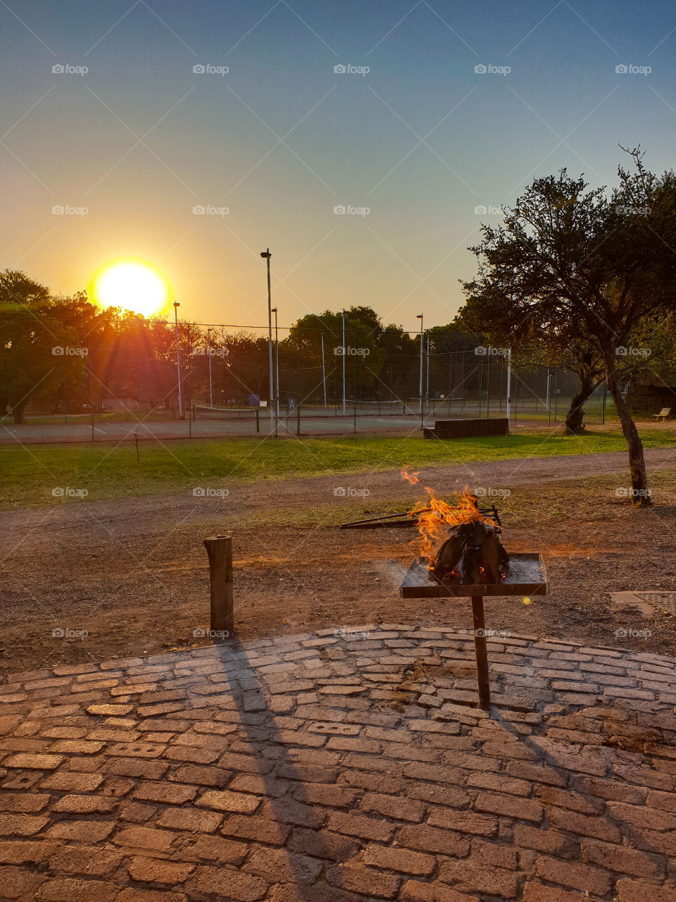 sunset with a fire burning