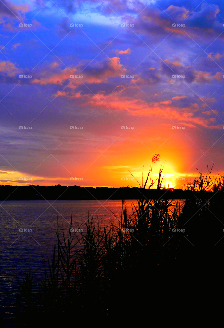 Incredible Sunsets! I am a Sunset enthusiast! The brilliant crimson, amber,tangerine, and blue hues of the sunsets sweep the sky and the surface of the waterways as the beautiful colors embrace the heavenly sky! Breathtaking!