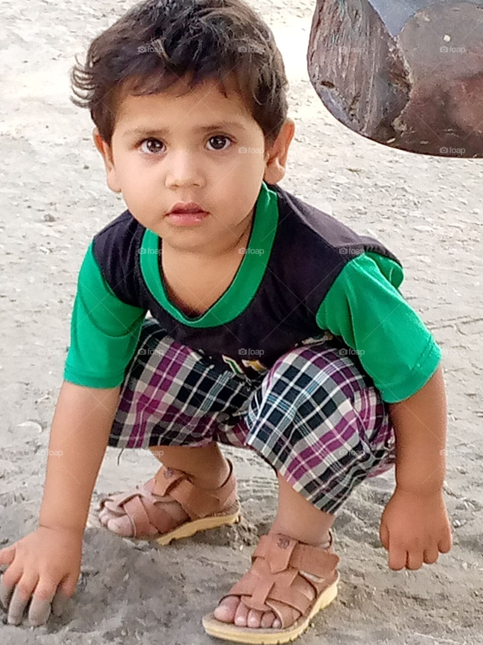 my cute nephew, giving po's with doing some work