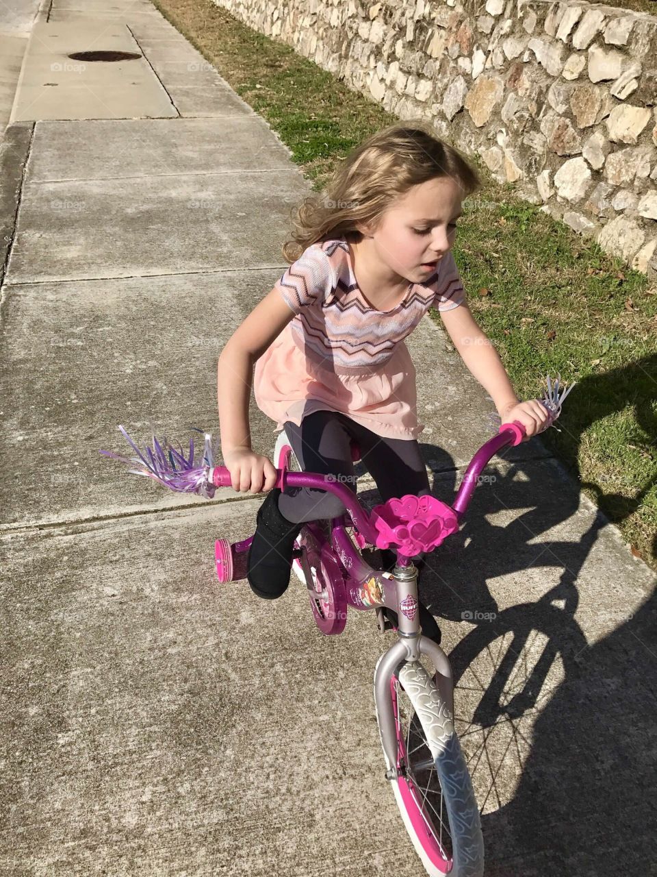 My daughter riding her bike on her own 