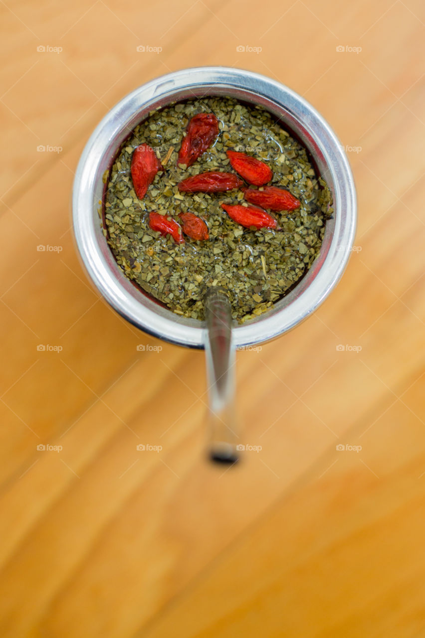 Yerba mate in gourd with goji berries 