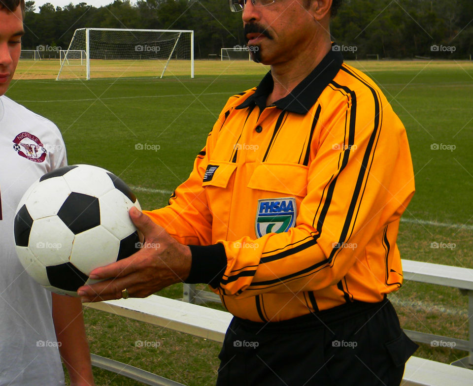 Soccer ref. Man in yellow