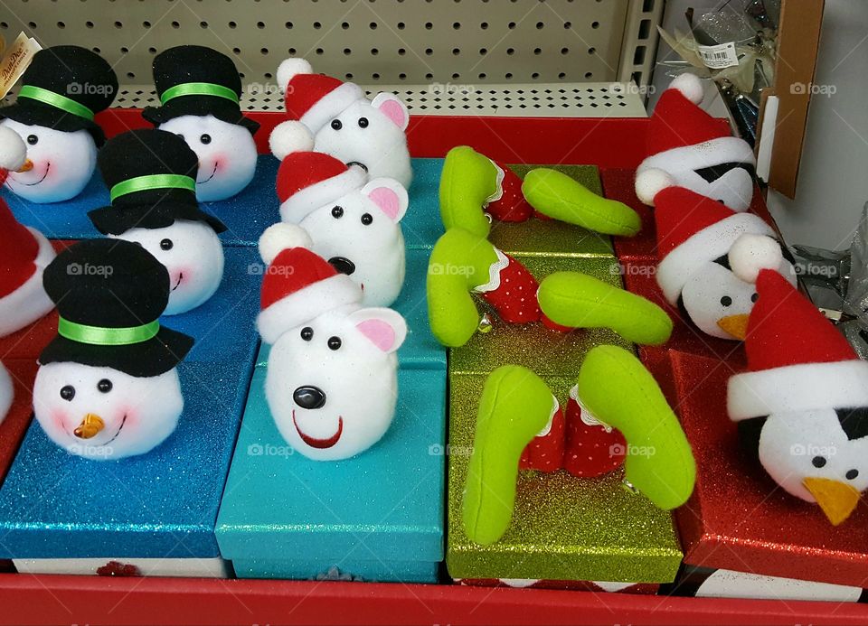 It took me a while but I finally figured out that the green candy canes sandwiched between the cute little heads on these boxes were probably supposed to be the Grinch stuck upside down in a present lol.