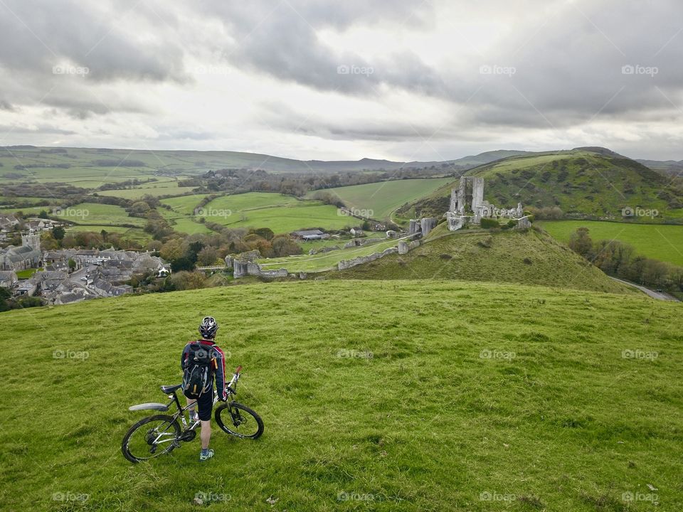 A good buddy of mine exploring corfe by bike. Just coming into view of the castle. Captured by dji Mavic Pro 