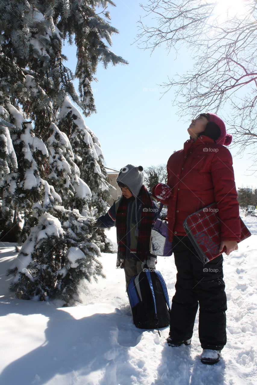 Kids walking home from school on a beautiful winter day