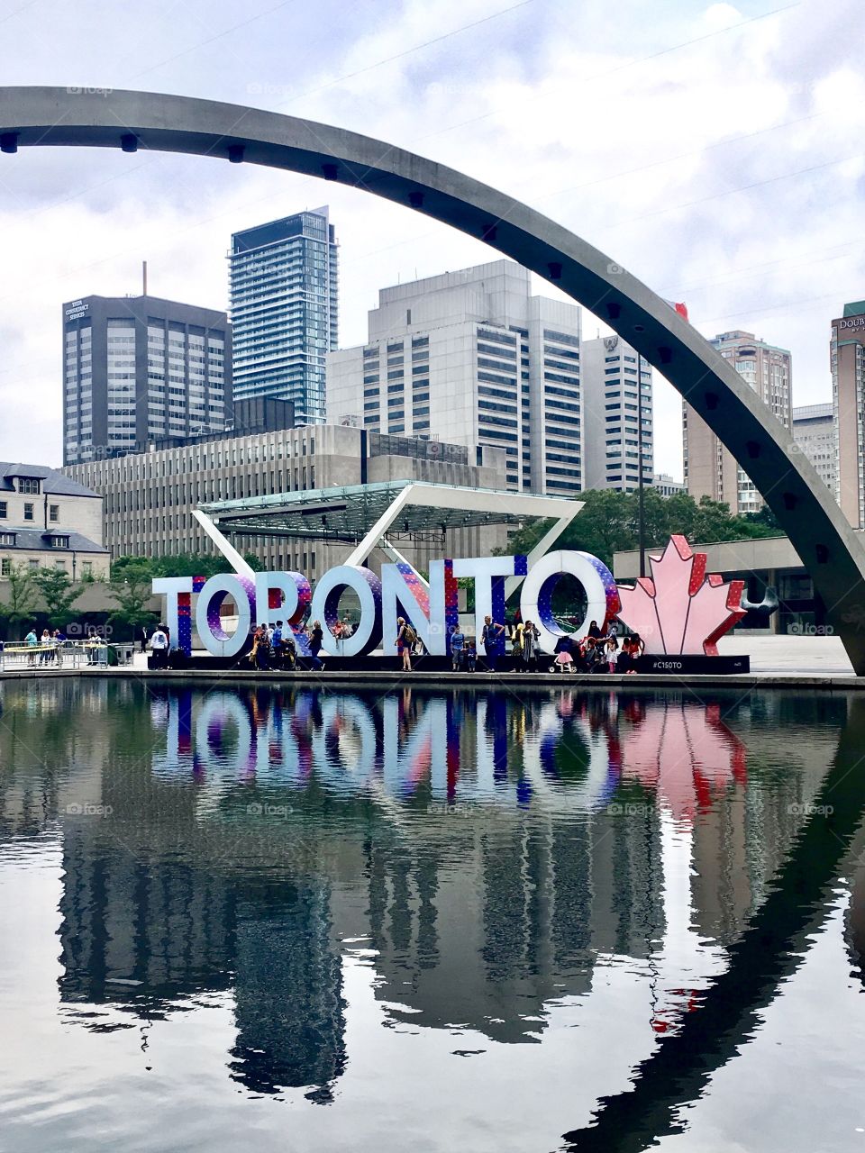 Toronto sign reflecting in the water 