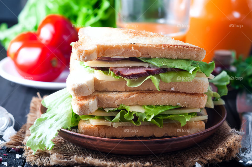 homemade sandwich with salad, cheese and meat