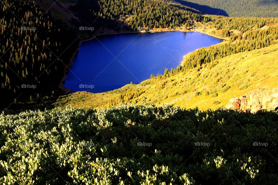 Scenic view of idyllic blue lake