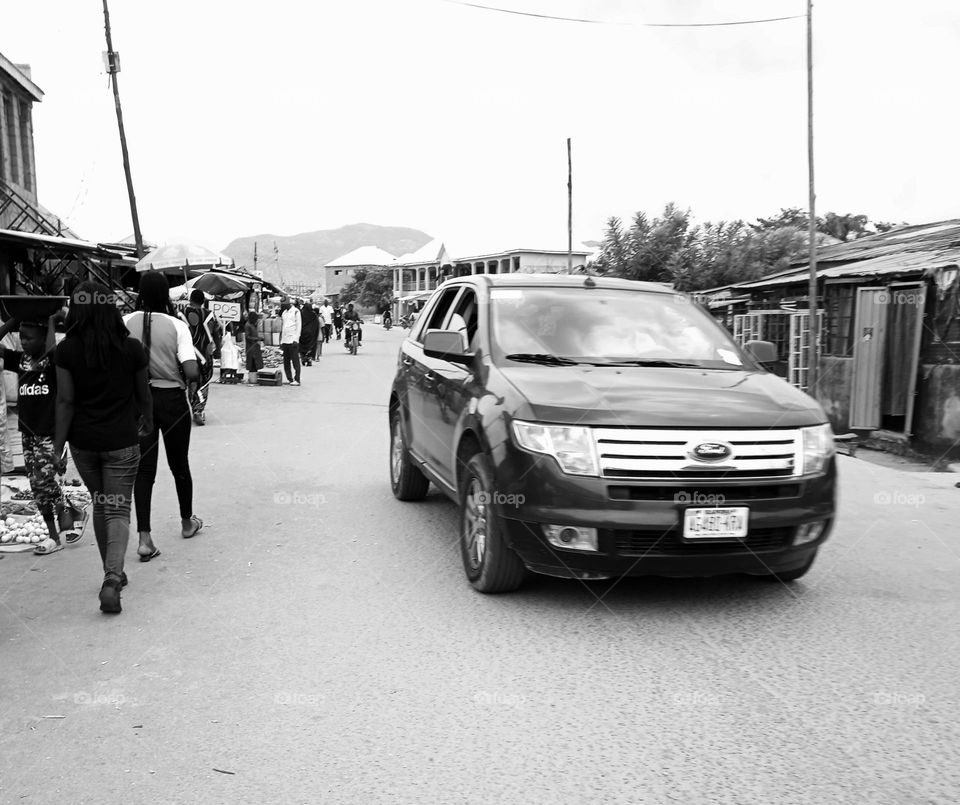 Driving through Tudu Market