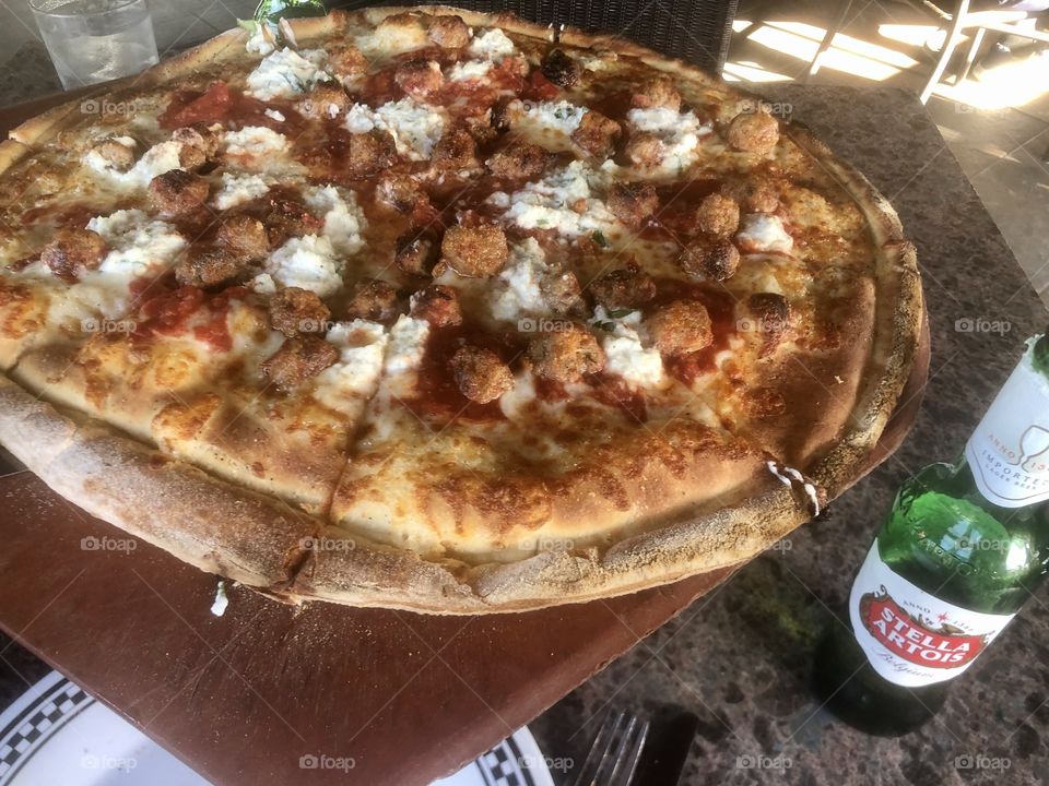 Meatball pizza with beer