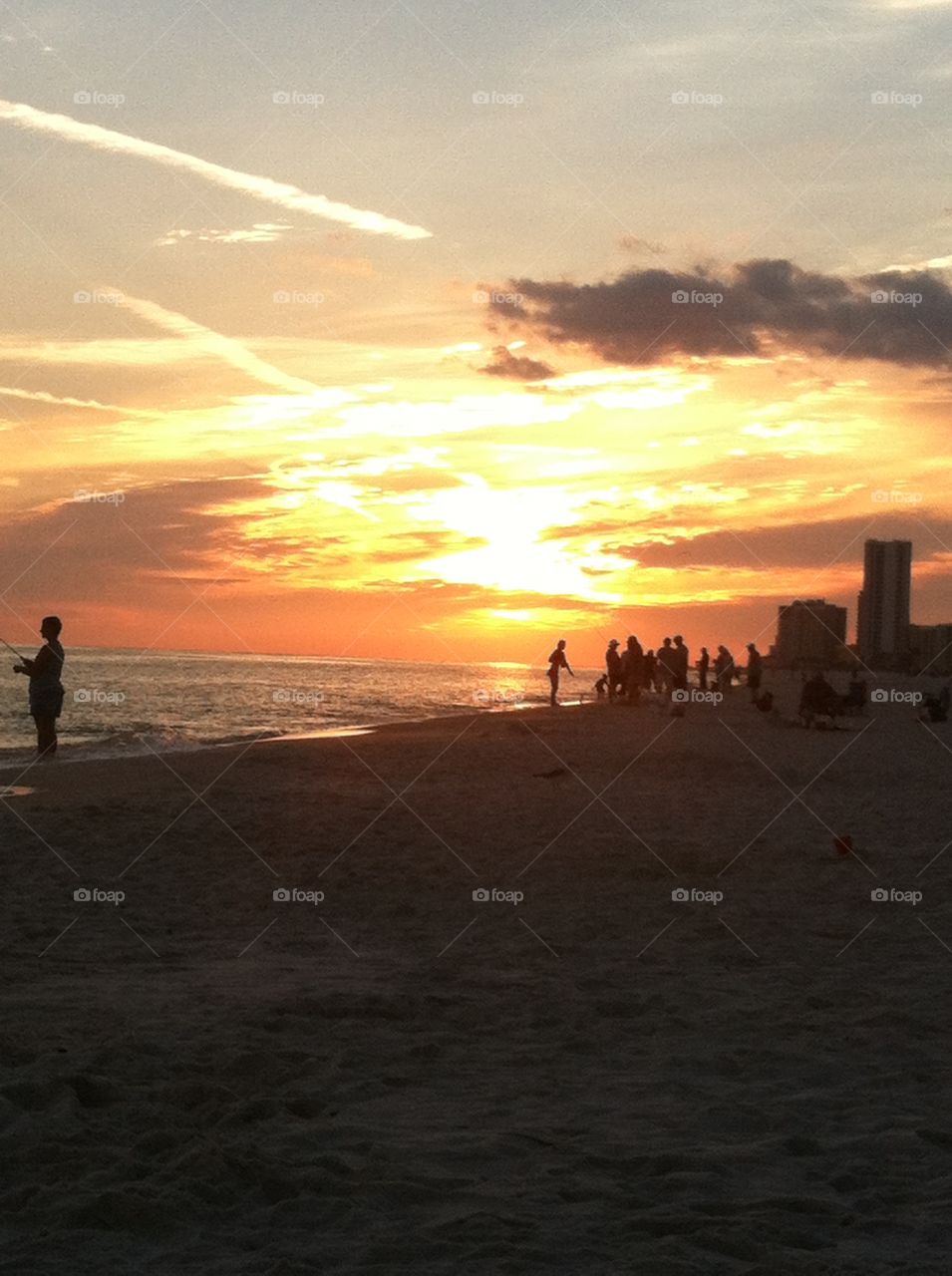 Silhouettes in the beach sunset.