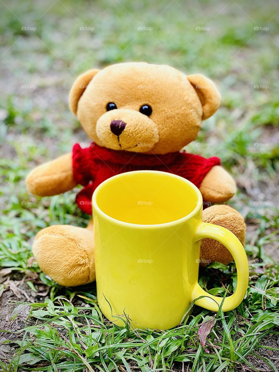 Cute teddy bear and a mug