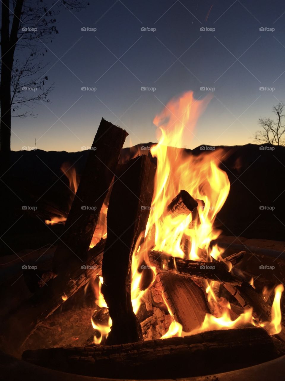 Mountain campfire sunset