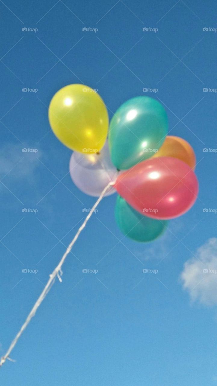 Beautiful and multicolor balloons embraced blue high sky at essaouira city in Morocco.