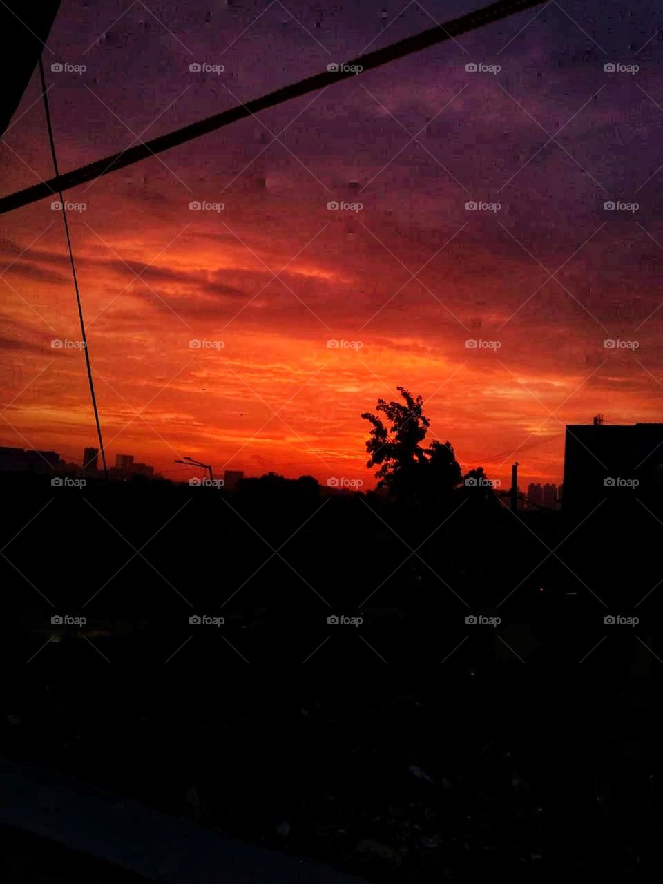 The sky looks like a painting with those red and purple hues as the sun sets. Nature's own masterpiece! 🌅✨