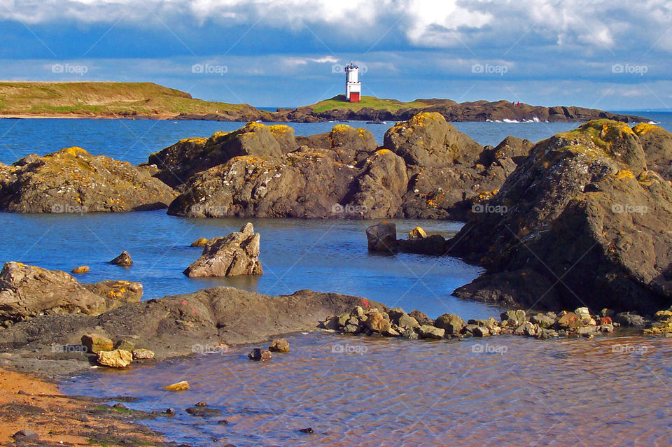 summer sea rocks lighthouse by eddie.kelly.7