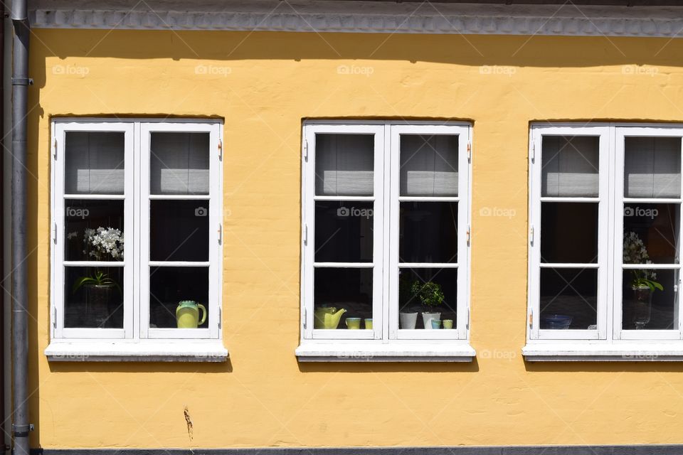 A front of yellow home