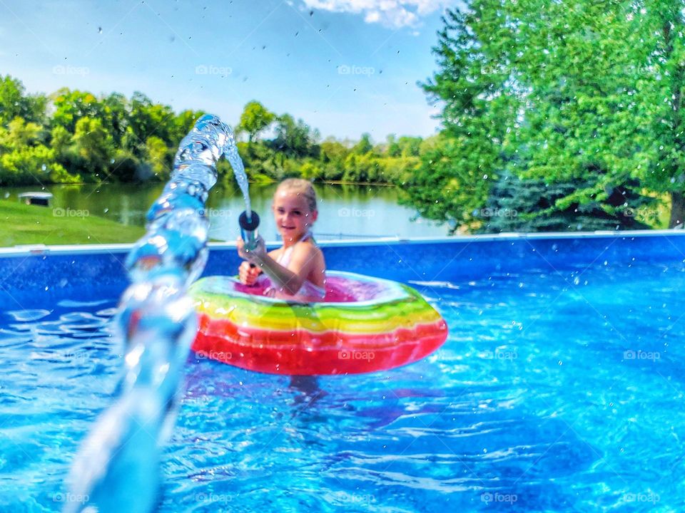 squirt gun  fight in pool girl