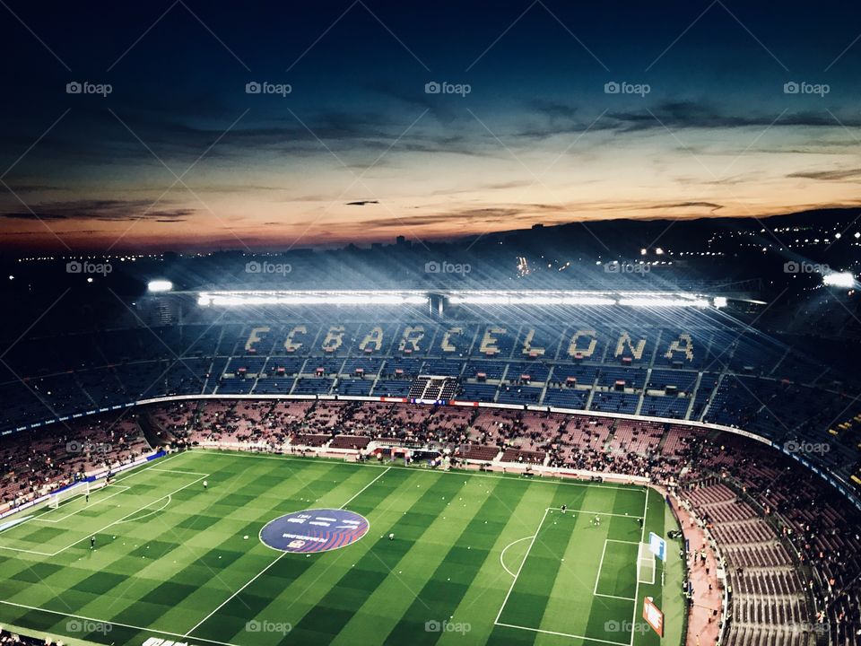 Amazing picture of Barcelona stadium focusing on the the wordings and the sky 