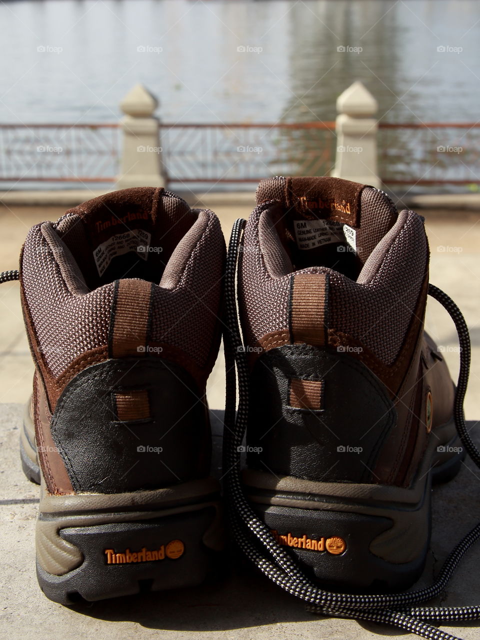 Brown Waterproof Leather Timberland Hiking Boots facing to Chao Phraya River  in the morning