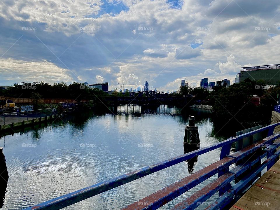 I’m walking over the “Borden Avenue Bridge” over “Dutch Kills” back towards “Newtown Creek” and the “Pulaski Bridge” admiring the beautiful mirror image of the landscape and the sea. 2023. Hypnotic Productions
