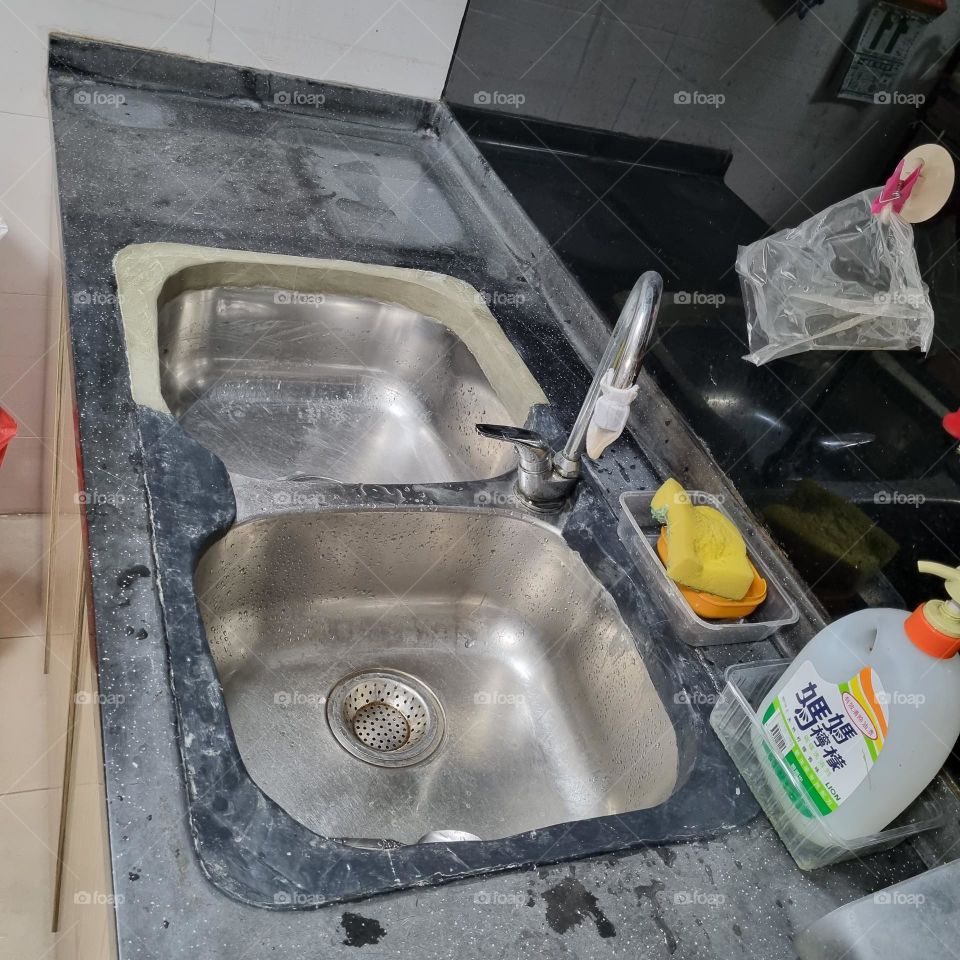 Cement rim around kitchen sink