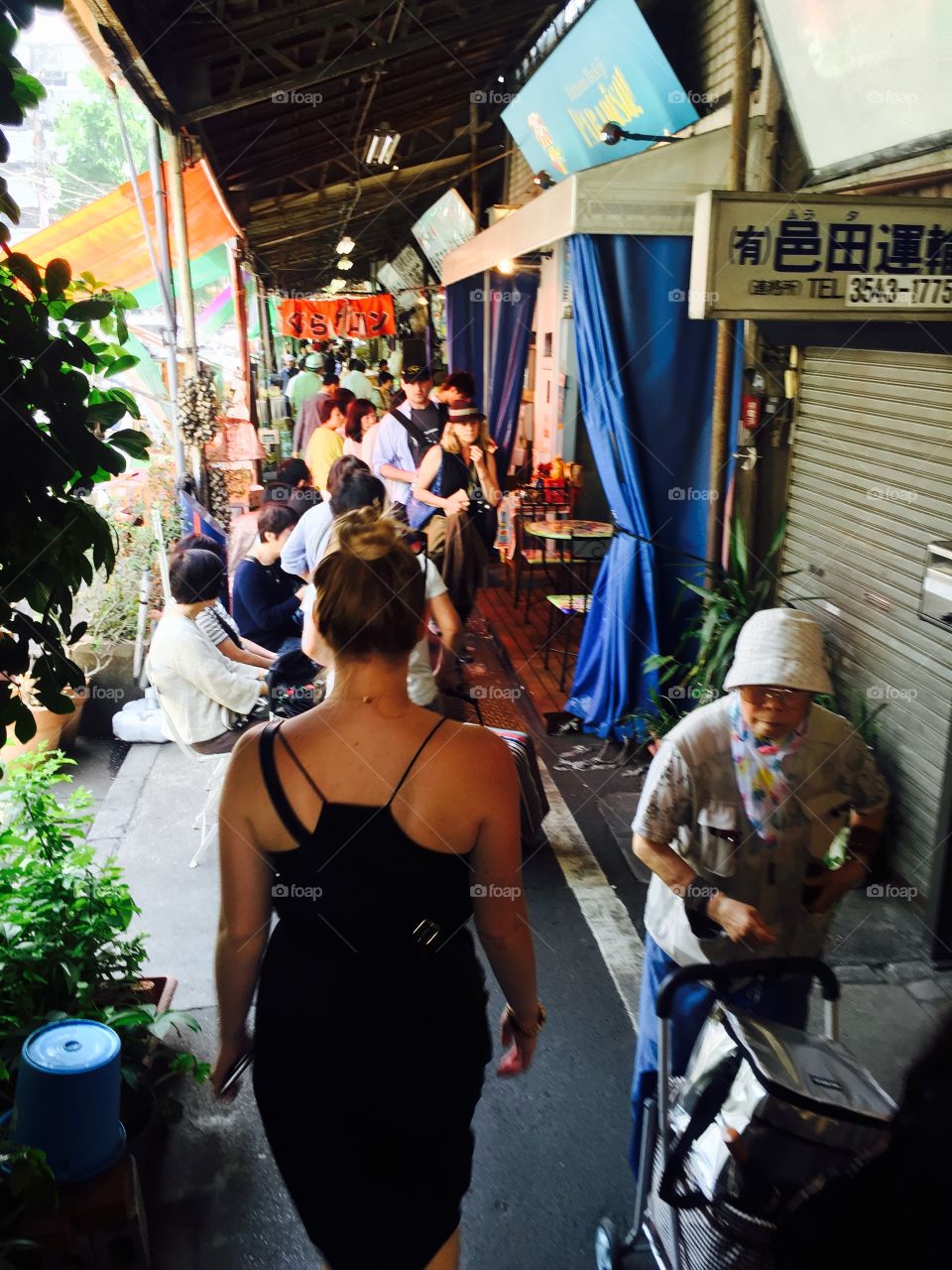 Walking through the markets. My sister walking through the busy Tsukiji fish markets in Tokyo