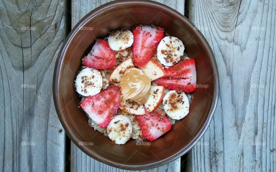 Oats with apple, banana and strawberries