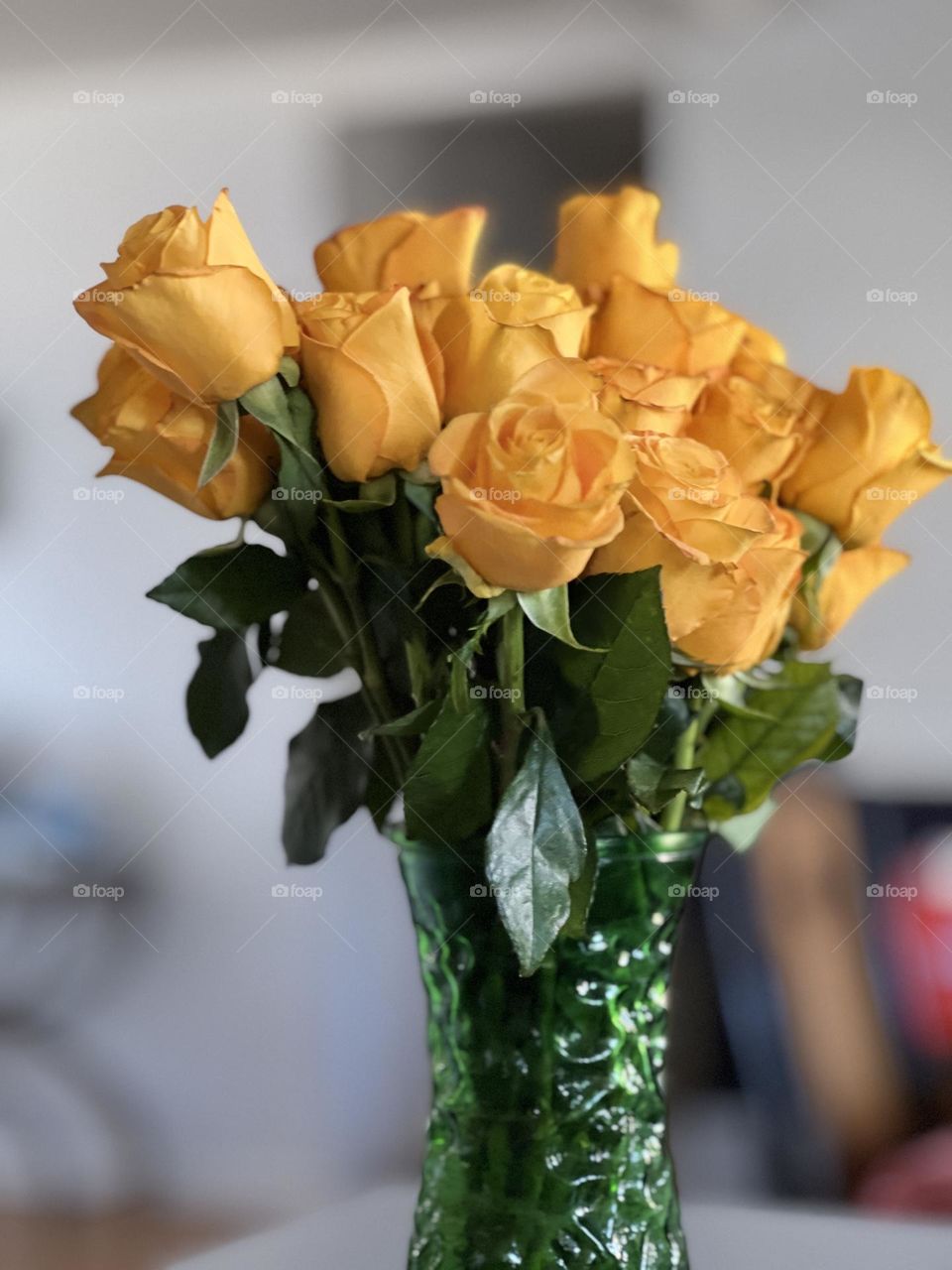 Boquete of Yellow Rose buds in a green vase