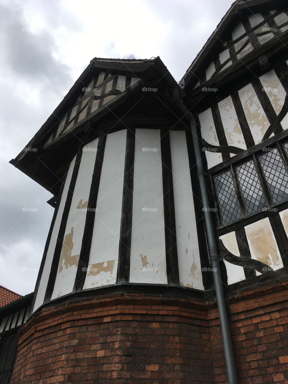 Exterior view of timber framing and windows of the mediaeval Manor House of Gainsborough Old Hall in England
