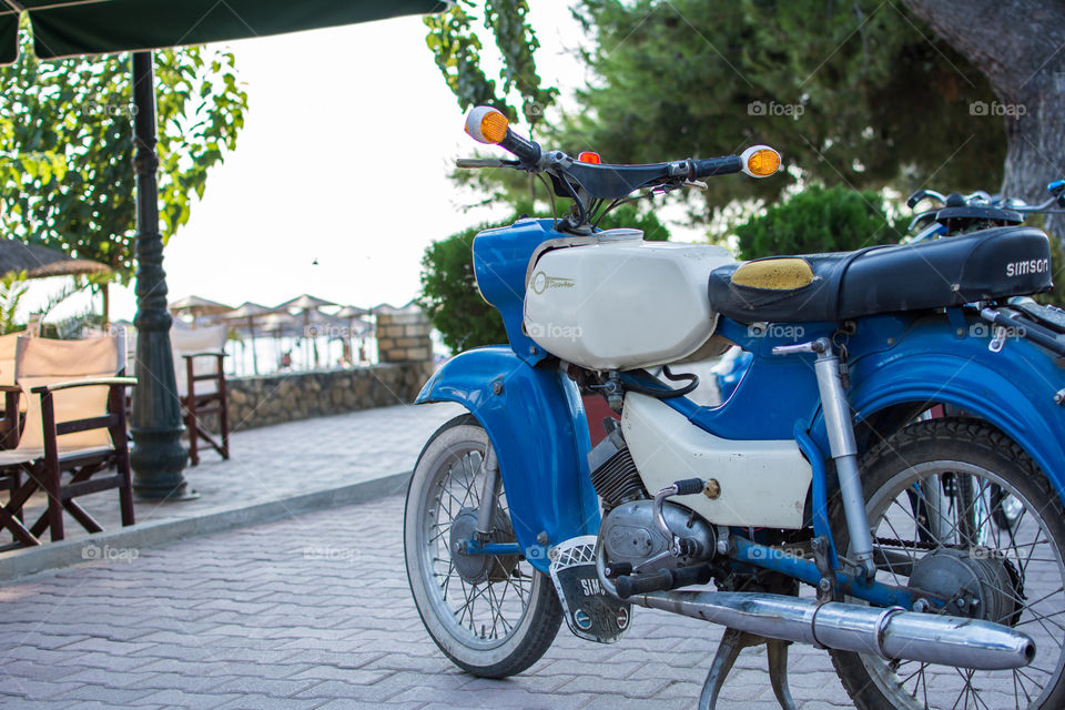 vintage simson motorcycle on the beach