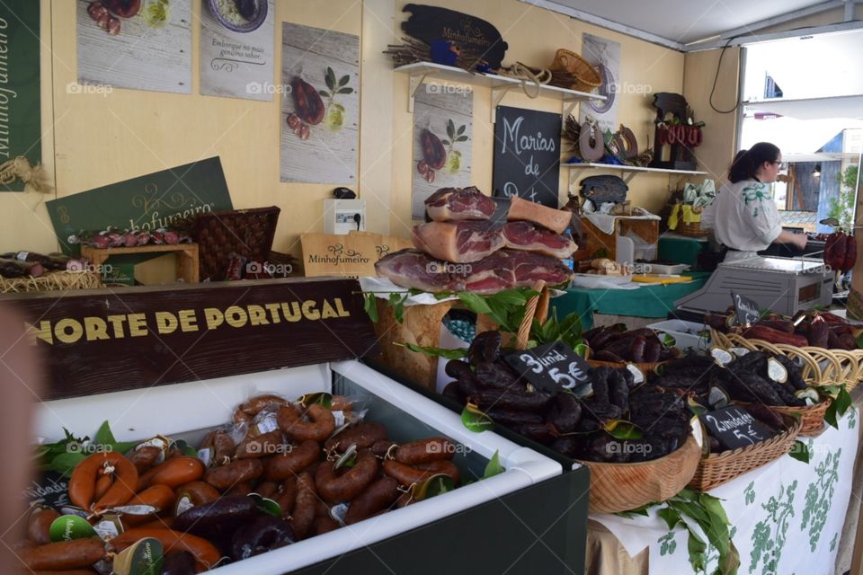 Selection of meats and sausages to choose from at the food market in Portugal 