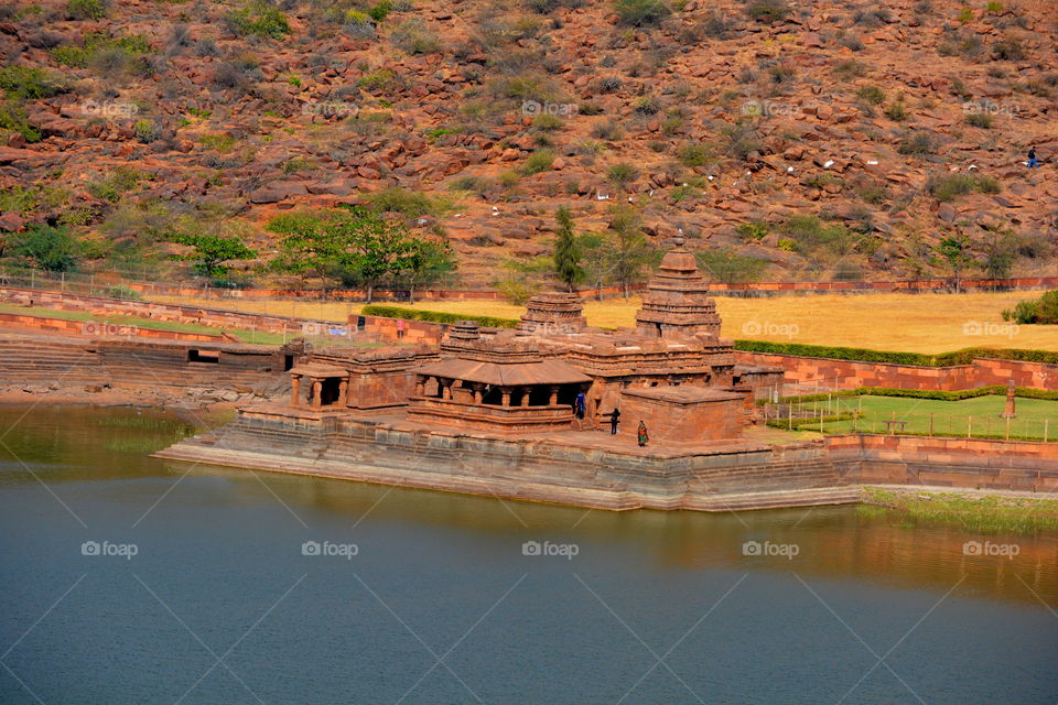 temple on side of a lake, architectural heritage site.