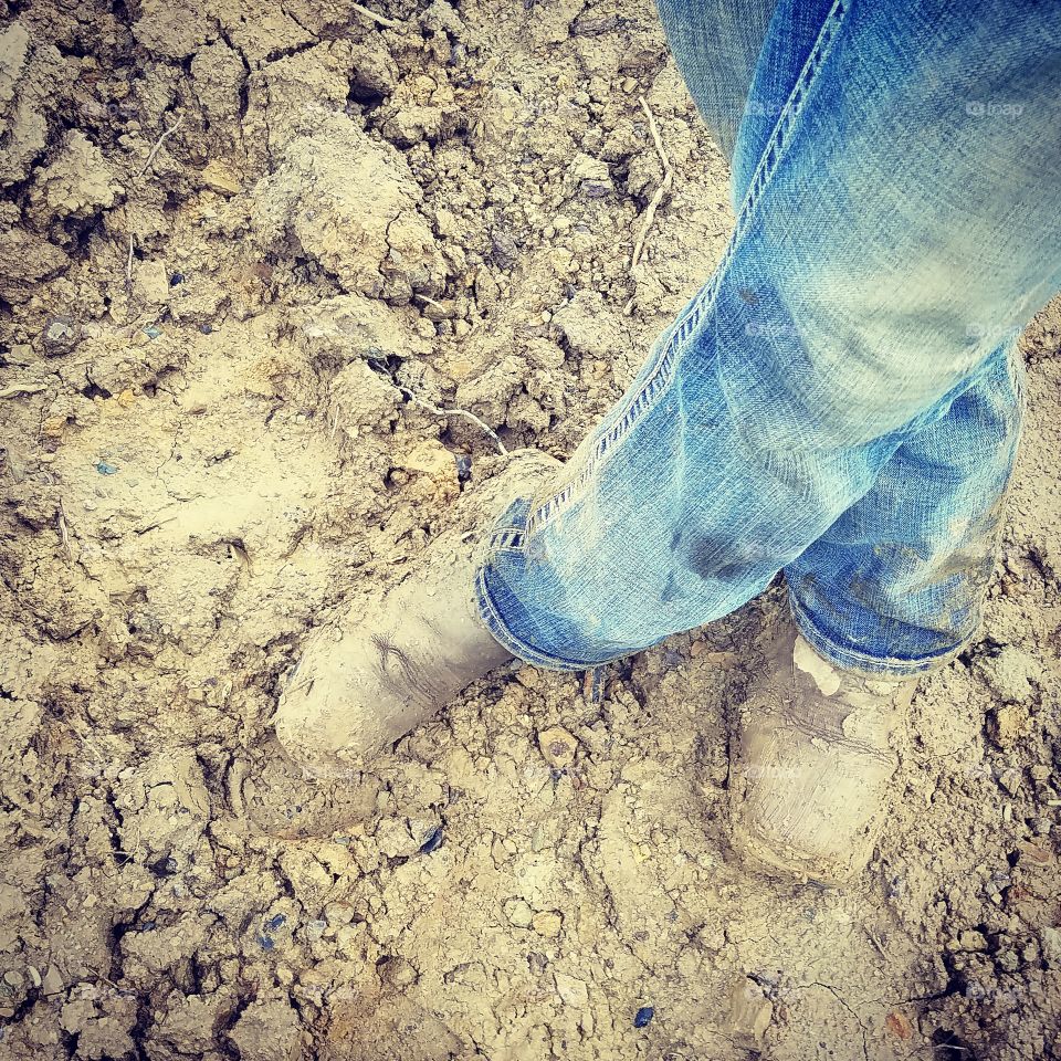 Feet in mud.