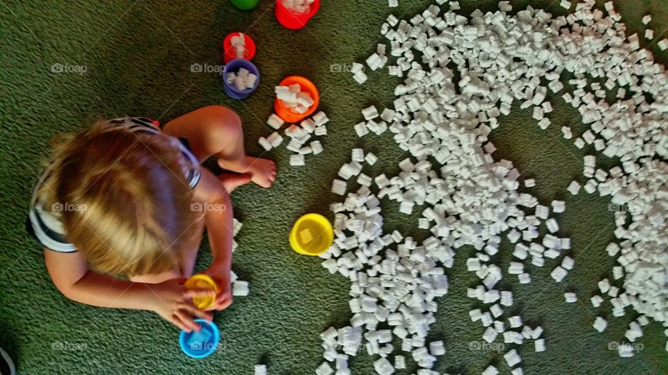 Cali filling stacking cups with peanuts