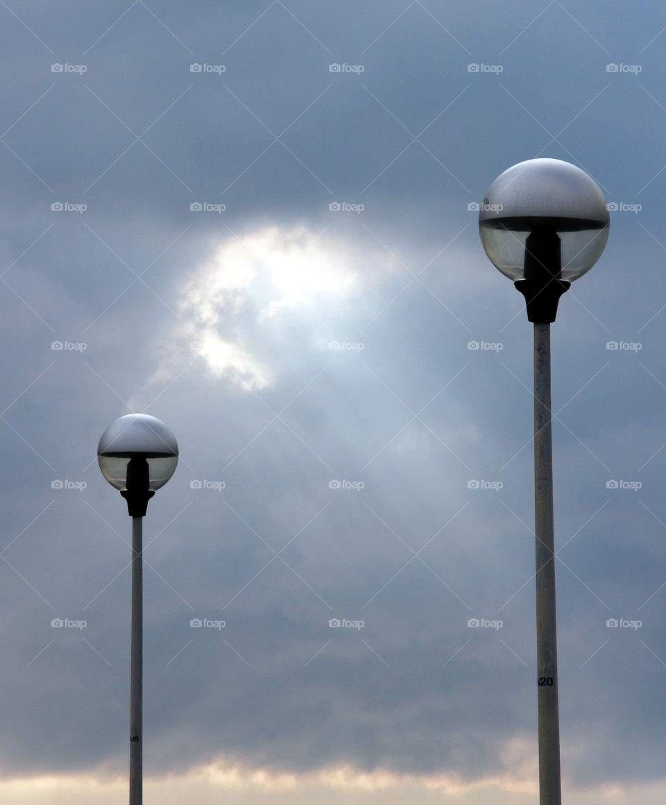 sunrays and two street lamps