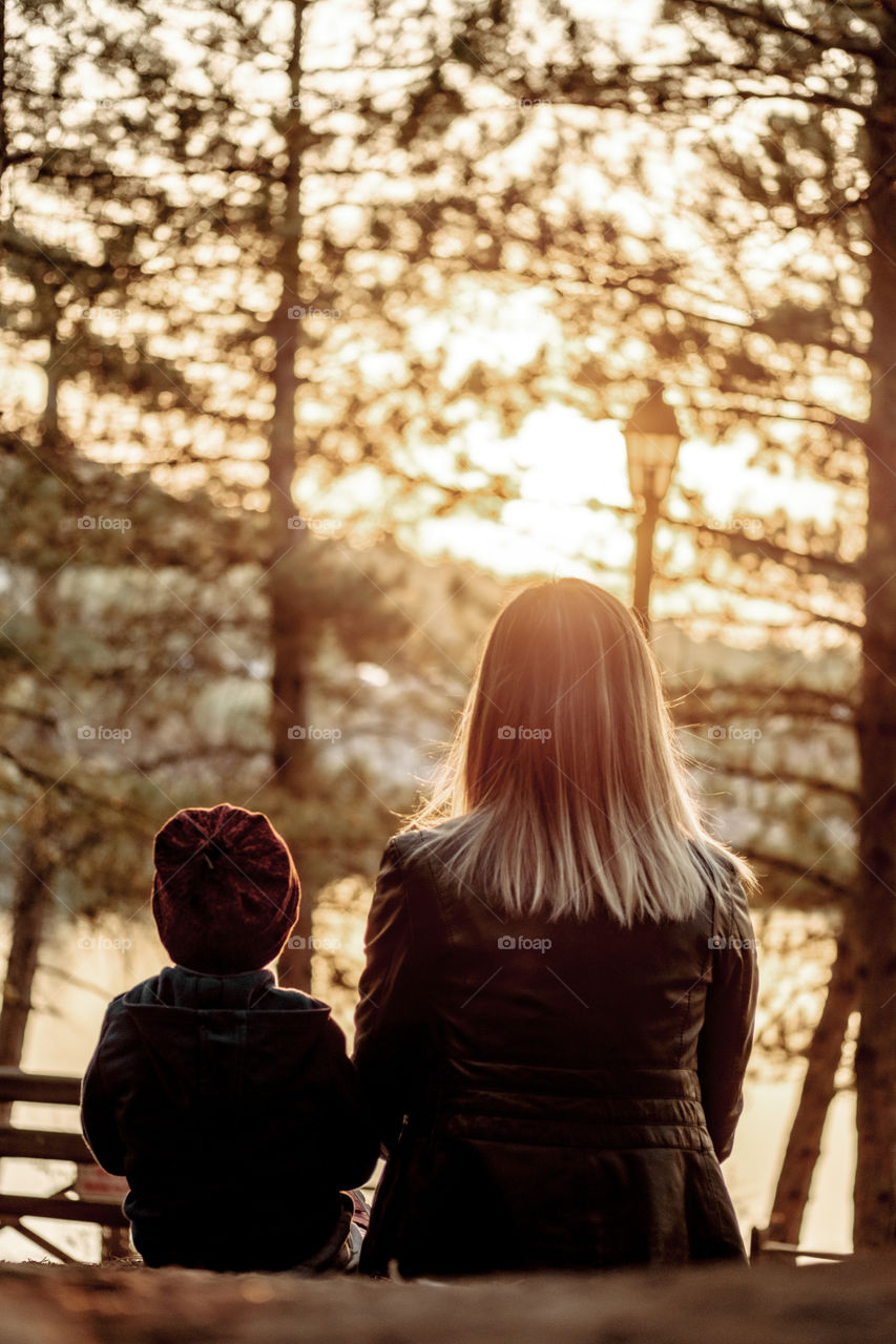 Mother and son sitting