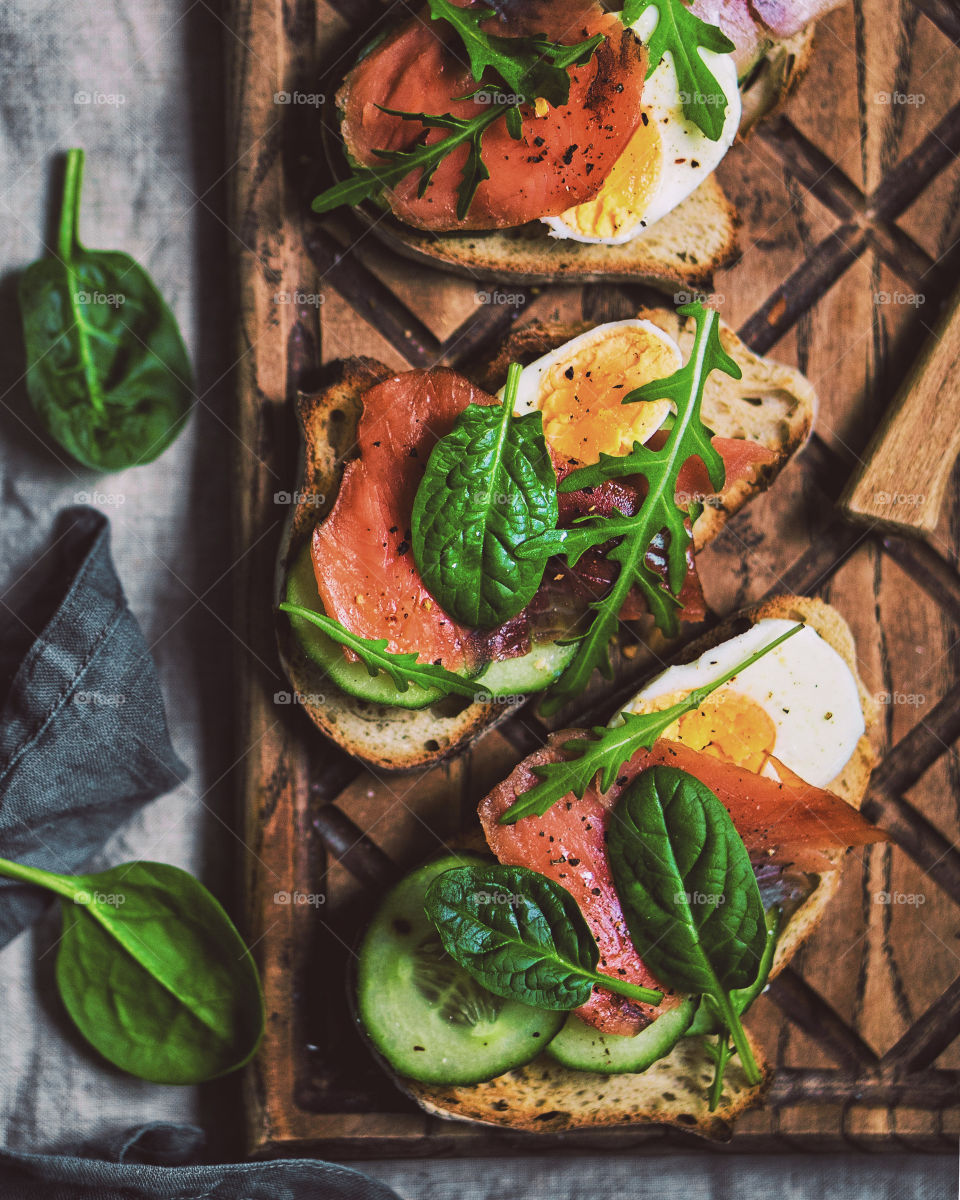 Sandwich with salmon, egg and cucumber