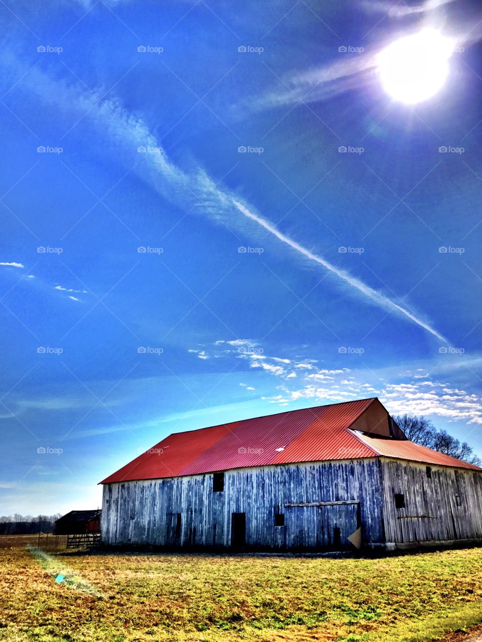 Red barn on grassy field